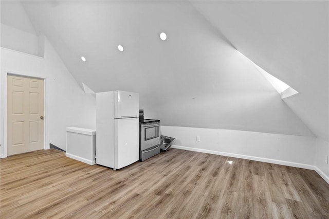 bonus room with baseboards, light wood-type flooring, vaulted ceiling with skylight, and recessed lighting