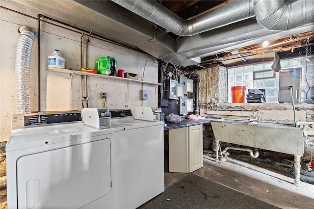 laundry area with separate washer and dryer and laundry area