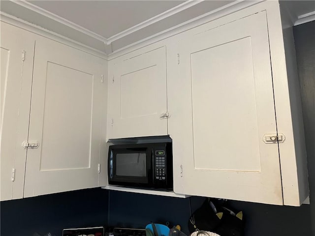 details with black microwave and crown molding
