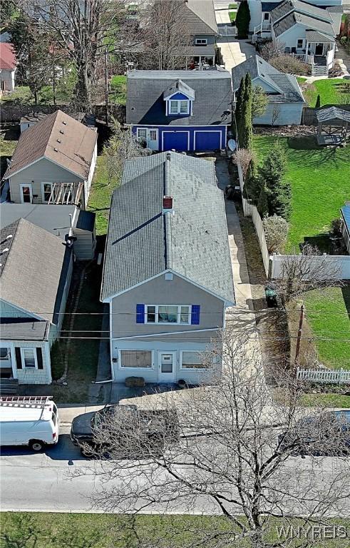 birds eye view of property with a residential view