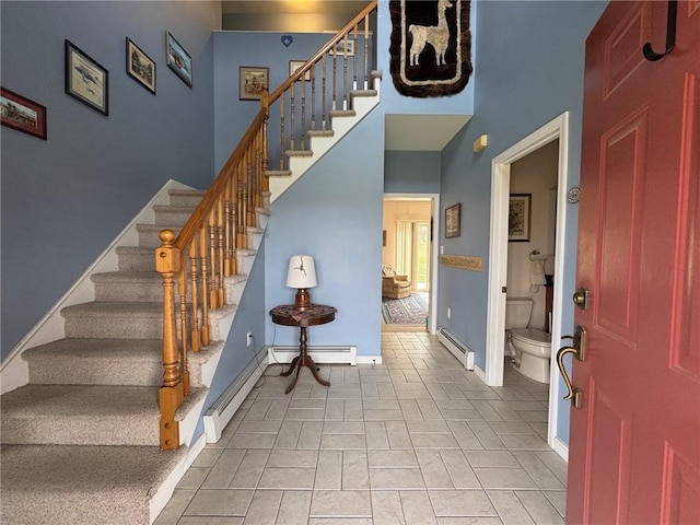 5876 Clearview Ln, Alfred, NY 14803 - foyer entrance with a baseboard radiator, stairway, baseboard heating, baseboards, and a high ceiling
