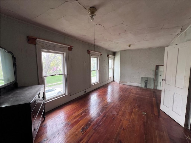 unfurnished dining area featuring a healthy amount of sunlight and wood-type flooring