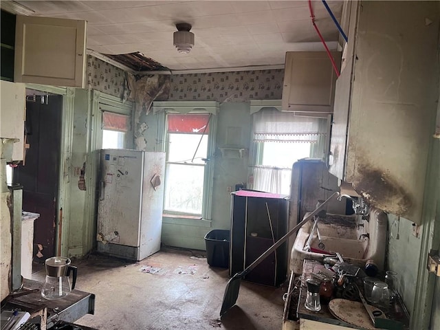 kitchen with freestanding refrigerator