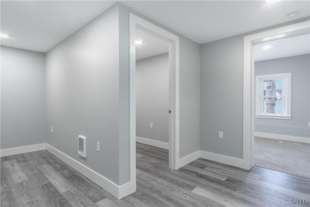 interior space with wood finished floors and baseboards