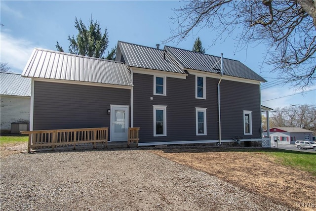 exterior space featuring metal roof