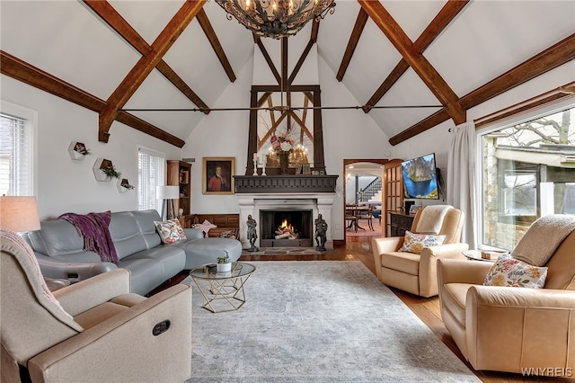 4482 Lower River Rd, Lewiston, NY 14092 - living room featuring high vaulted ceiling, beam ceiling, wood finished floors, and a notable chandelier