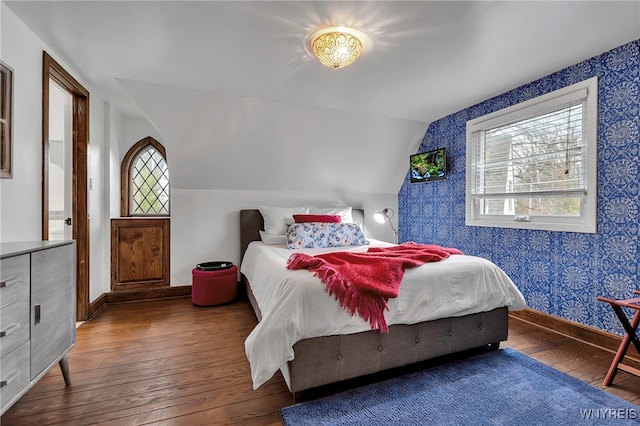 4482 Lower River Rd, Lewiston, NY 14092 - bedroom with hardwood / wood-style flooring, multiple windows, vaulted ceiling, and wallpapered walls