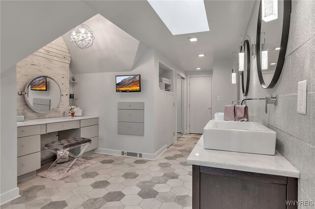 4482 Lower River Rd, Lewiston, NY 14092 - full bathroom featuring vanity, a skylight, tile patterned floors, baseboards, and recessed lighting