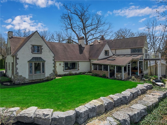 4482 Lower River Rd, Lewiston, NY 14092 - rear view of house featuring a chimney, roof with shingles, a lawn, central air condition unit, and stucco siding