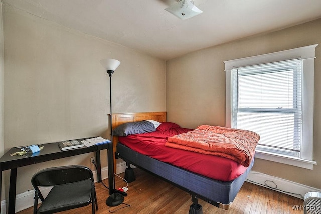 bedroom with wood finished floors