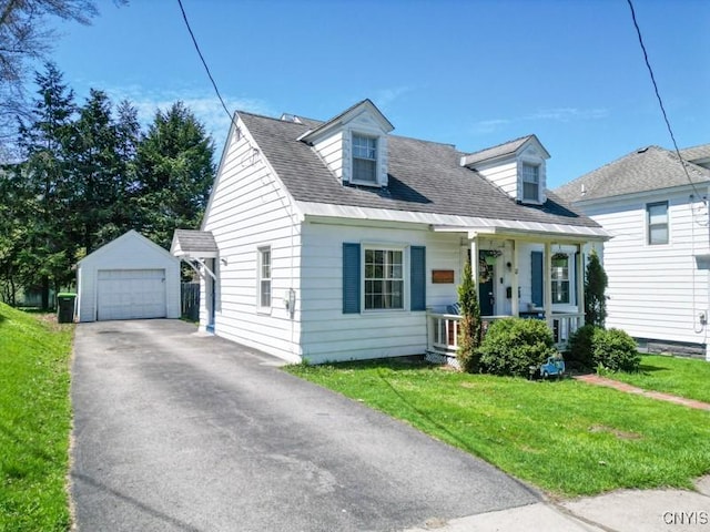 cape cod-style house with covered porch, driveway, a detached garage, an outdoor structure, and a front lawn