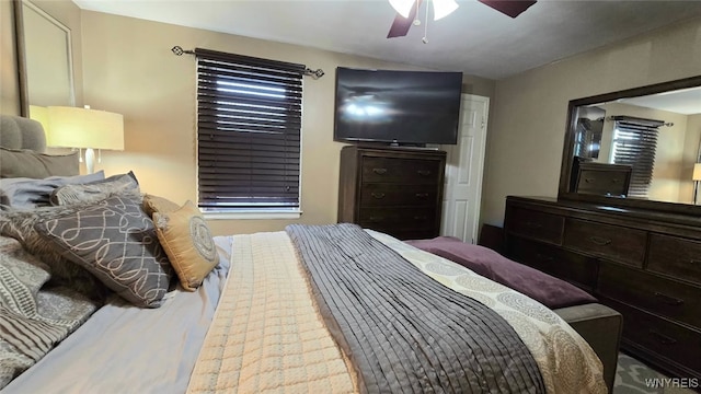 bedroom with ceiling fan and vaulted ceiling