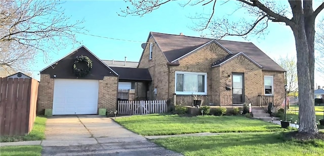 view of front of home with fence, a front lawn, concrete driveway, and brick siding