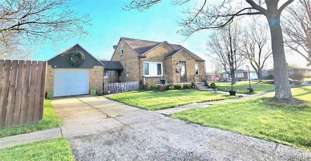 view of front of property with brick siding, fence, driveway, a front lawn, and an attached garage