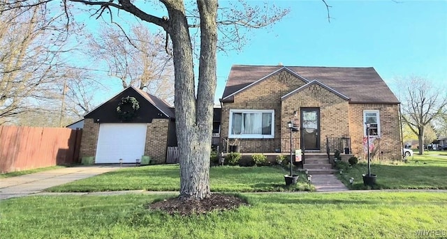 view of front facade with concrete driveway, fence, a front yard, and brick siding