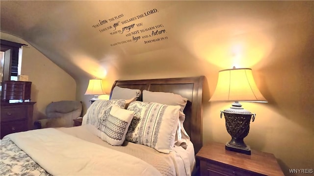 bedroom featuring vaulted ceiling