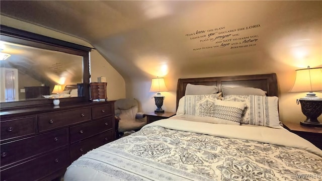 bedroom featuring lofted ceiling