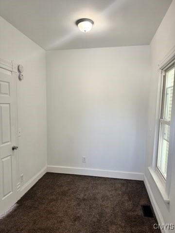 827-29 Burnet Ave Unit 29, Syracuse, NY 13203 - empty room featuring baseboards, visible vents, and dark carpet