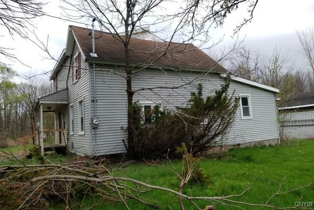 24 Railroad St, Elbridge, NY 13080 - view of side of property featuring roof with shingles