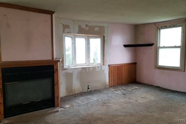 24 Railroad St, Elbridge, NY 13080 - unfurnished living room featuring a glass covered fireplace and plenty of natural light