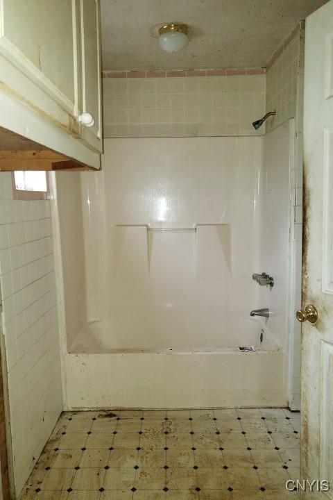 24 Railroad St, Elbridge, NY 13080 - bathroom with tile patterned floors and  shower combination
