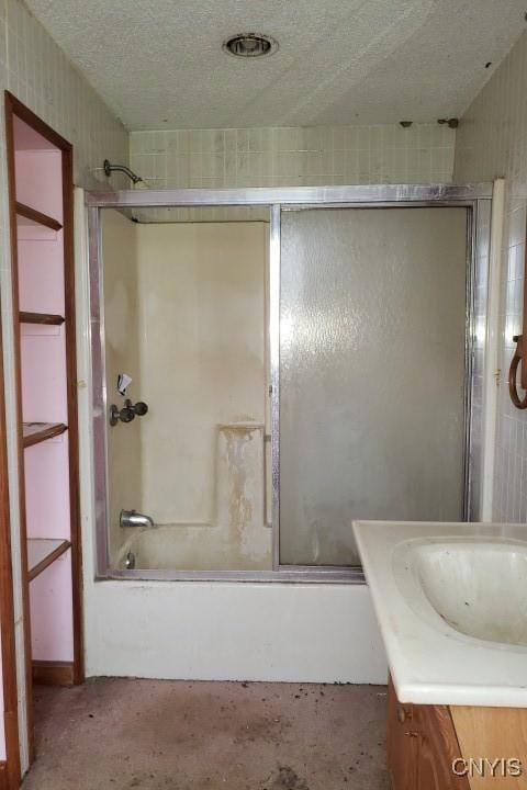 24 Railroad St, Elbridge, NY 13080 - bathroom with shower / bath combination with glass door, a textured ceiling, and vanity
