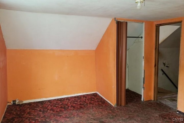 24 Railroad St, Elbridge, NY 13080 - bonus room with baseboards, lofted ceiling, and carpet flooring