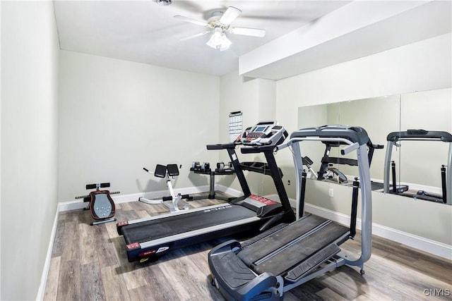workout room with wood finished floors, ceiling fan, and baseboards