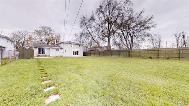 view of yard with a fenced backyard
