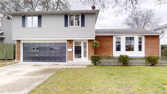split level home with fence, a front lawn, brick siding, and a garage