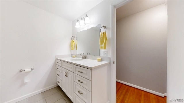 bathroom with baseboards and vanity