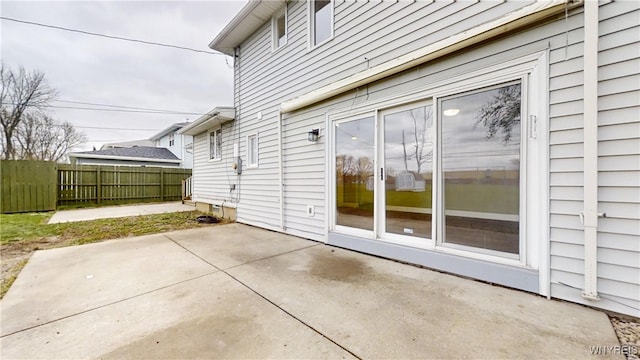view of patio featuring fence