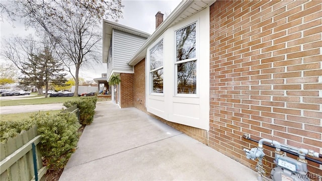 property entrance with brick siding