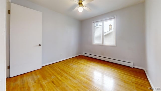 unfurnished room with ceiling fan, baseboards, light wood-style floors, and a baseboard radiator