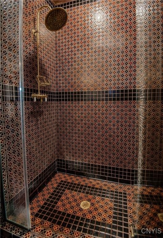 bathroom with tiled shower