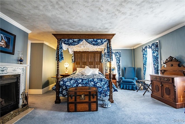 bedroom featuring carpet, crown molding, a high end fireplace, and a textured ceiling