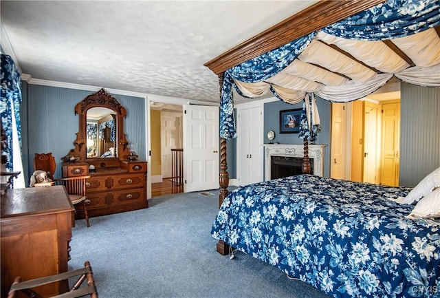 bedroom with ornamental molding and carpet flooring