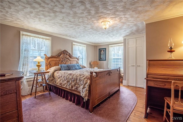bedroom featuring light wood-type flooring and ornamental molding