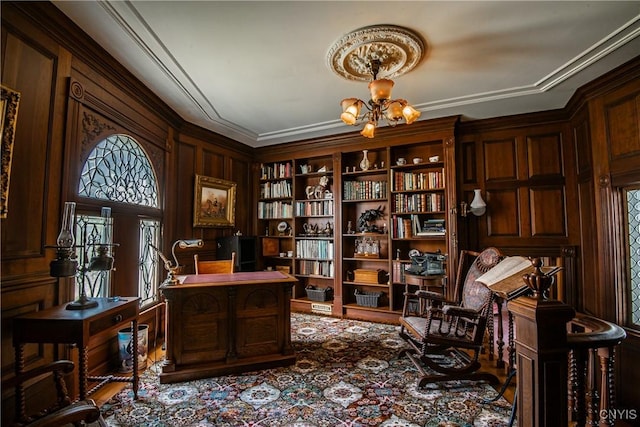 home office featuring ornamental molding and an inviting chandelier