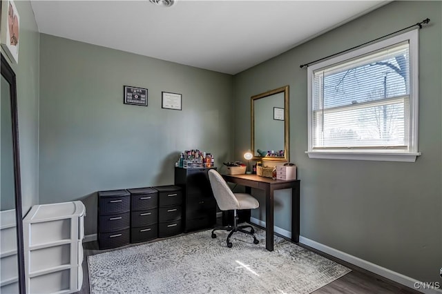 office with wood finished floors and baseboards