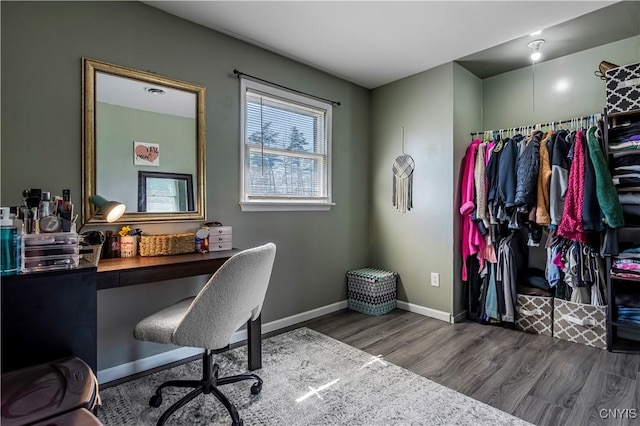 office area with baseboards and wood finished floors