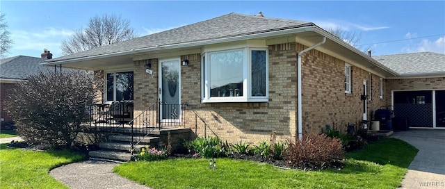 bungalow featuring a garage, brick siding, a shingled roof, and driveway