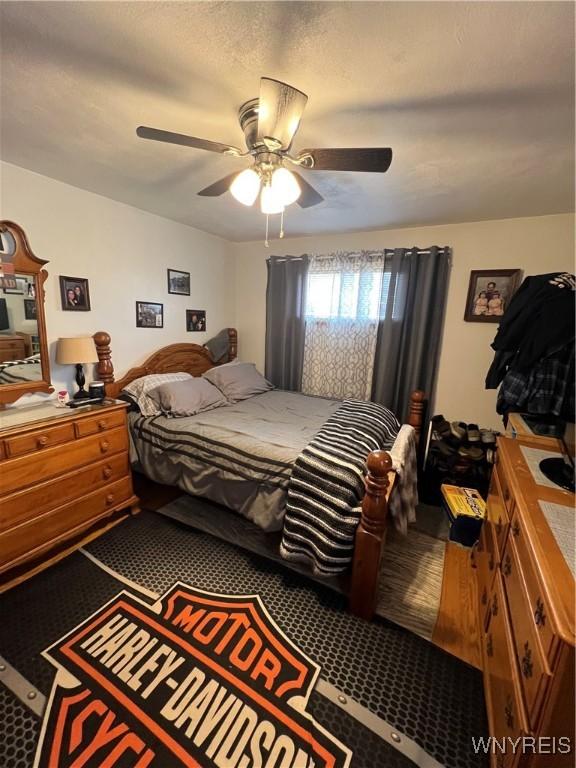 carpeted bedroom with a ceiling fan