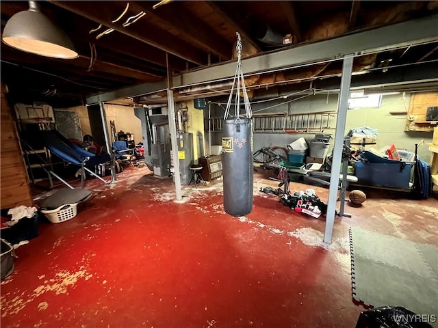 unfinished below grade area with heating unit, water heater, and electric water heater
