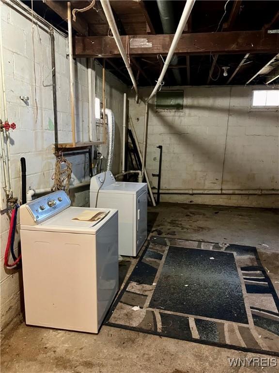 washroom with washer and dryer and laundry area