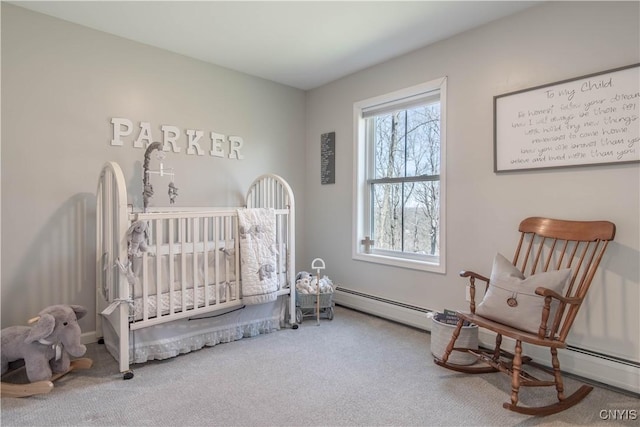 bedroom featuring baseboard heating and carpet floors