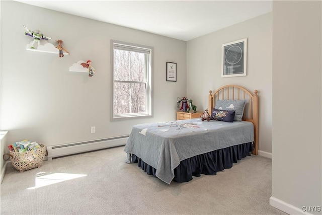 bedroom with a baseboard radiator, baseboards, and carpet floors