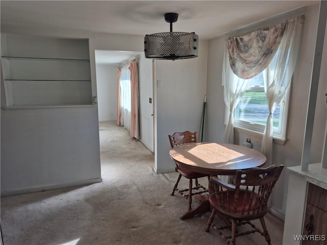 dining area with light carpet