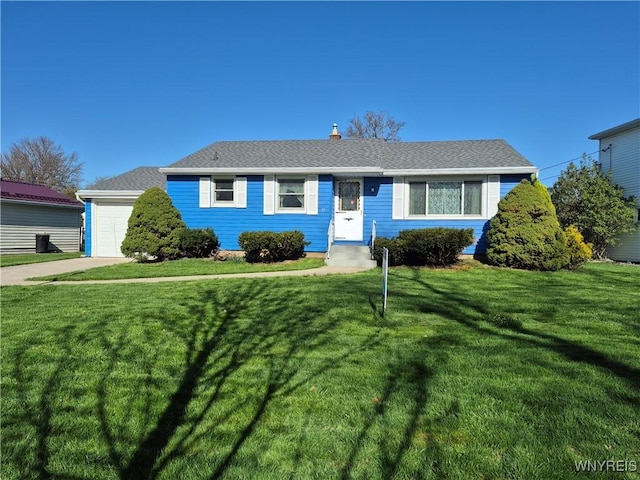 ranch-style home featuring a front lawn, a garage, and entry steps