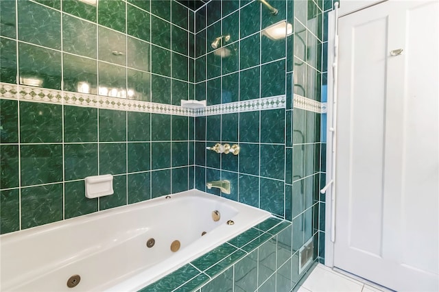 bathroom with a combined bath / shower with jetted tub and tile patterned flooring